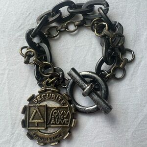 French Kande Mixed Metal Security Medallion Toggle Bracelet